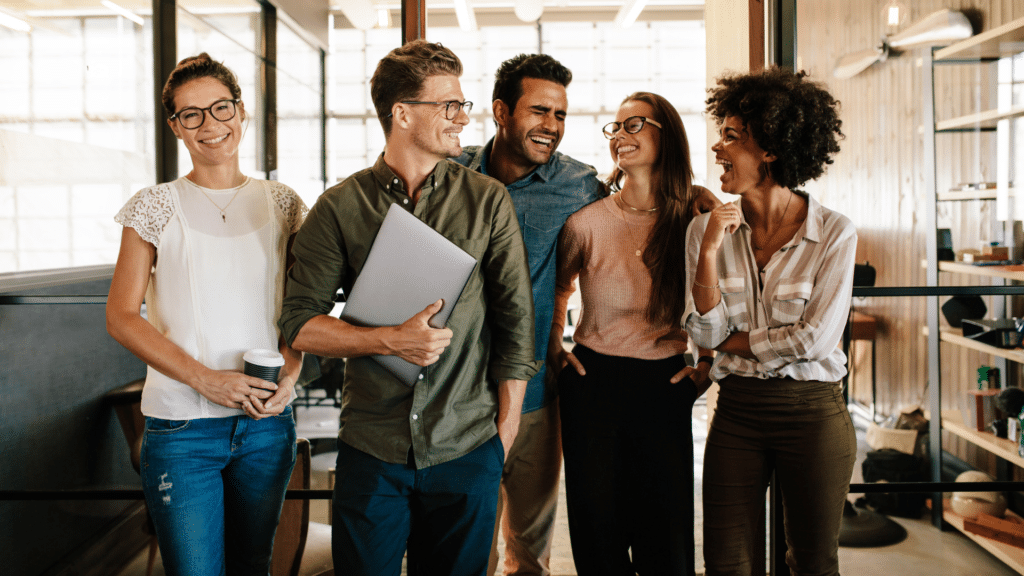 An image of a team of young entrepreneurs chatting about small business deductions in their Oakville office.